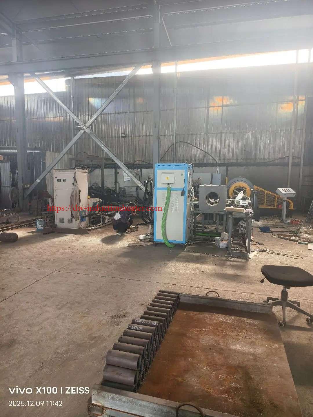 HLQ induction pipe and tube heating system installed in a fabrication workshop